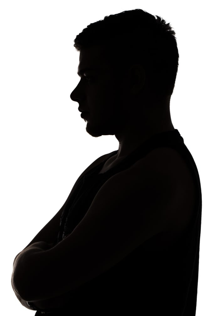 Photo of muscular man's silhouette in profile